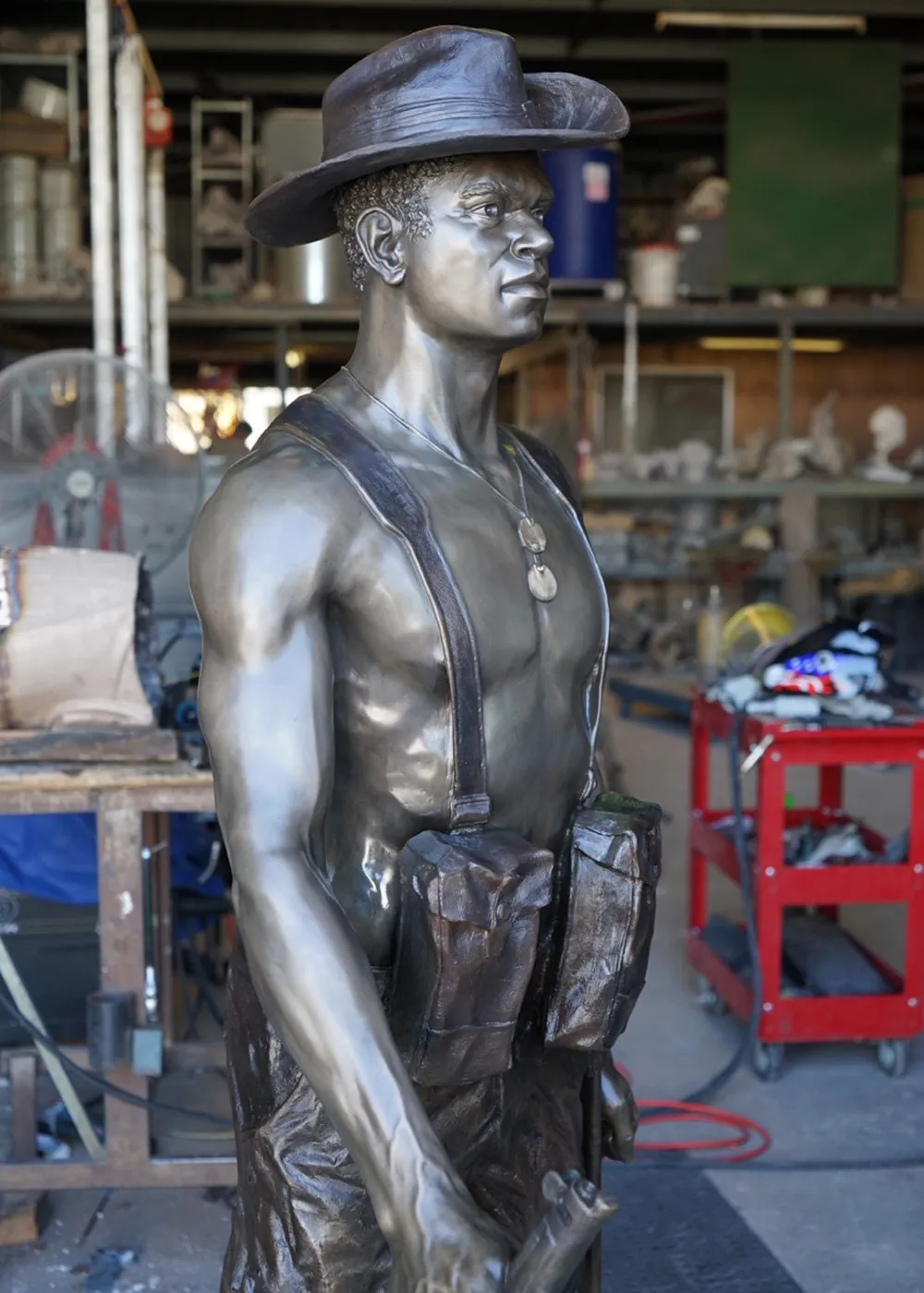 Full-length view of the intricately detailed bronze statue created by Sculpt Studios, representing the valor of the Torres Strait Islander soldiers from the WW2 Light Infantry Battalion.